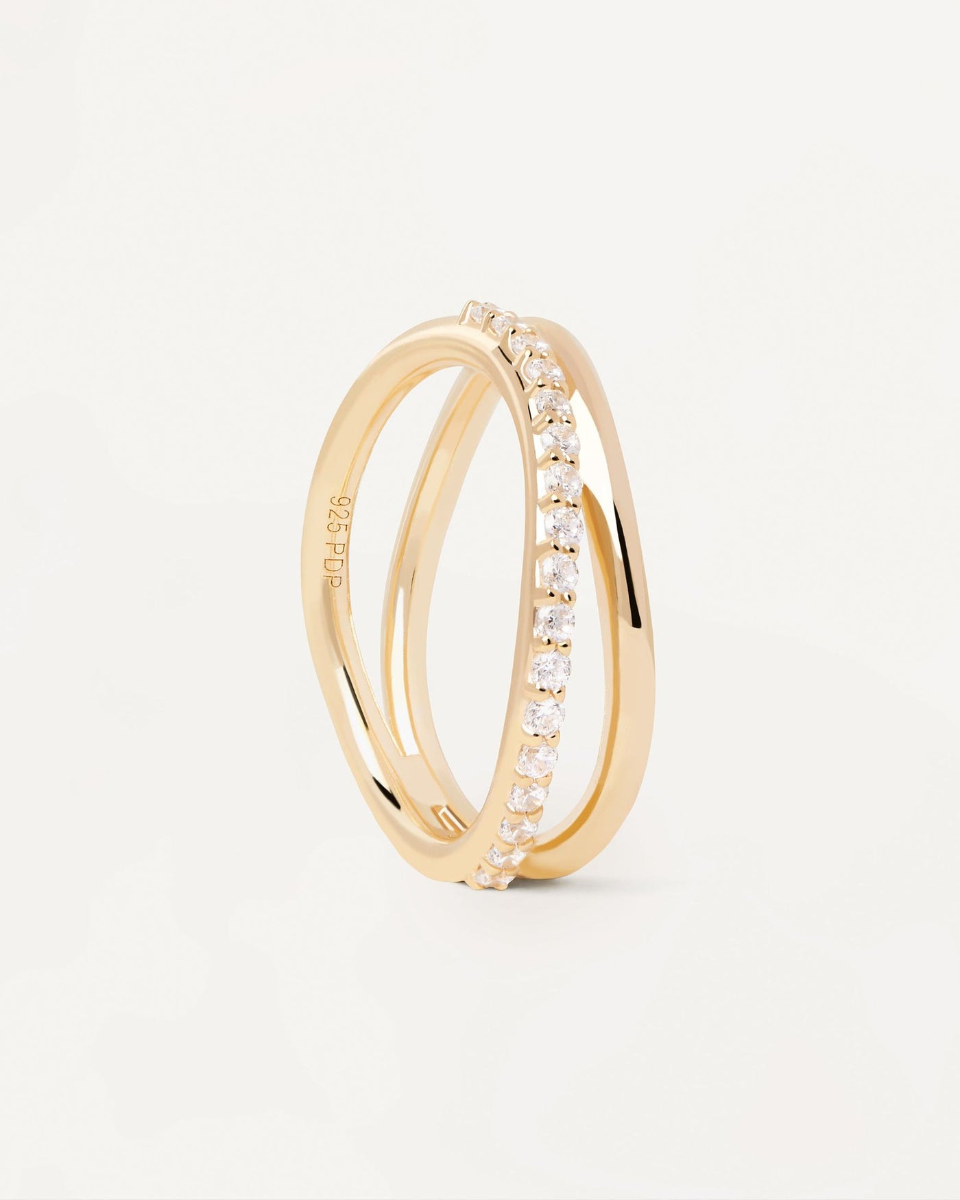2024 Selection | Twister Ring. Gold-plated ring with 2 wavy bands: plain and a zirconia eternity band. Get the latest arrival from PDPAOLA. Place your order safely and get this Best Seller. Free Shipping.