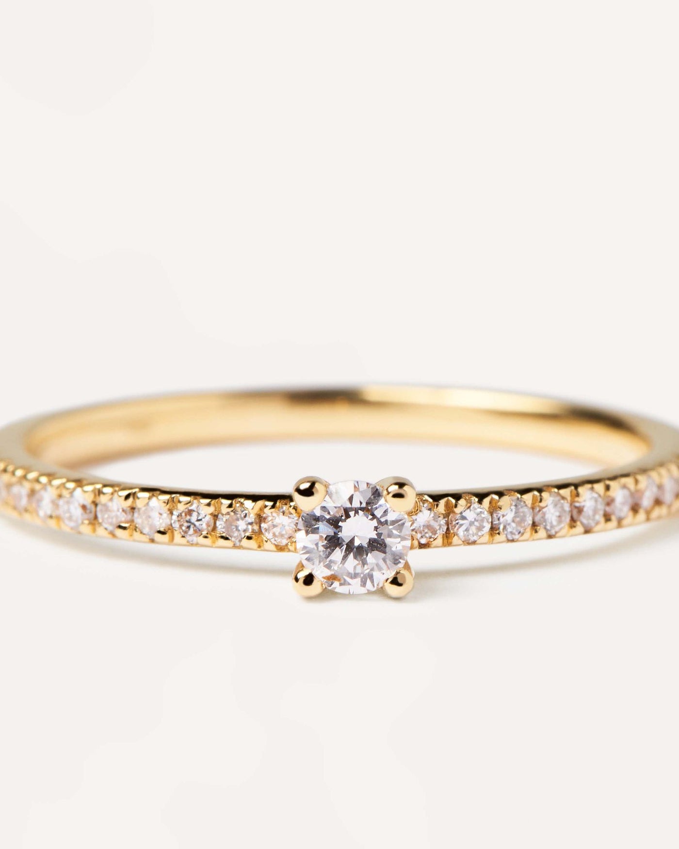 2024 Selection | Diamonds and gold Solstice Ring. Solid yellow gold ring with diamond eternity band and a round cut center diamond, making 0.31K. Get the latest arrival from PDPAOLA. Place your order safely and get this Best Seller. Free Shipping.