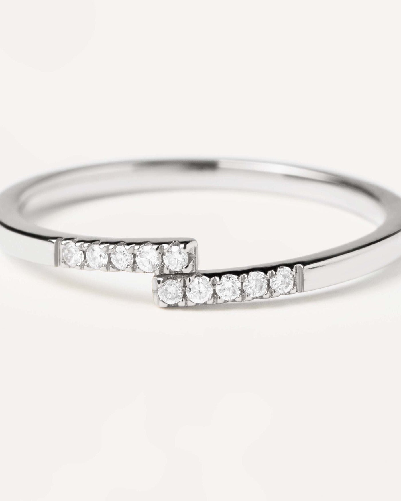 2024 Selection | Diamonds and White Gold Cross Ring. 18K white gold ring with 10 dainty diamonds meeting at the middle, equaling 0.06 carats. Get the latest arrival from PDPAOLA. Place your order safely and get this Best Seller. Free Shipping.