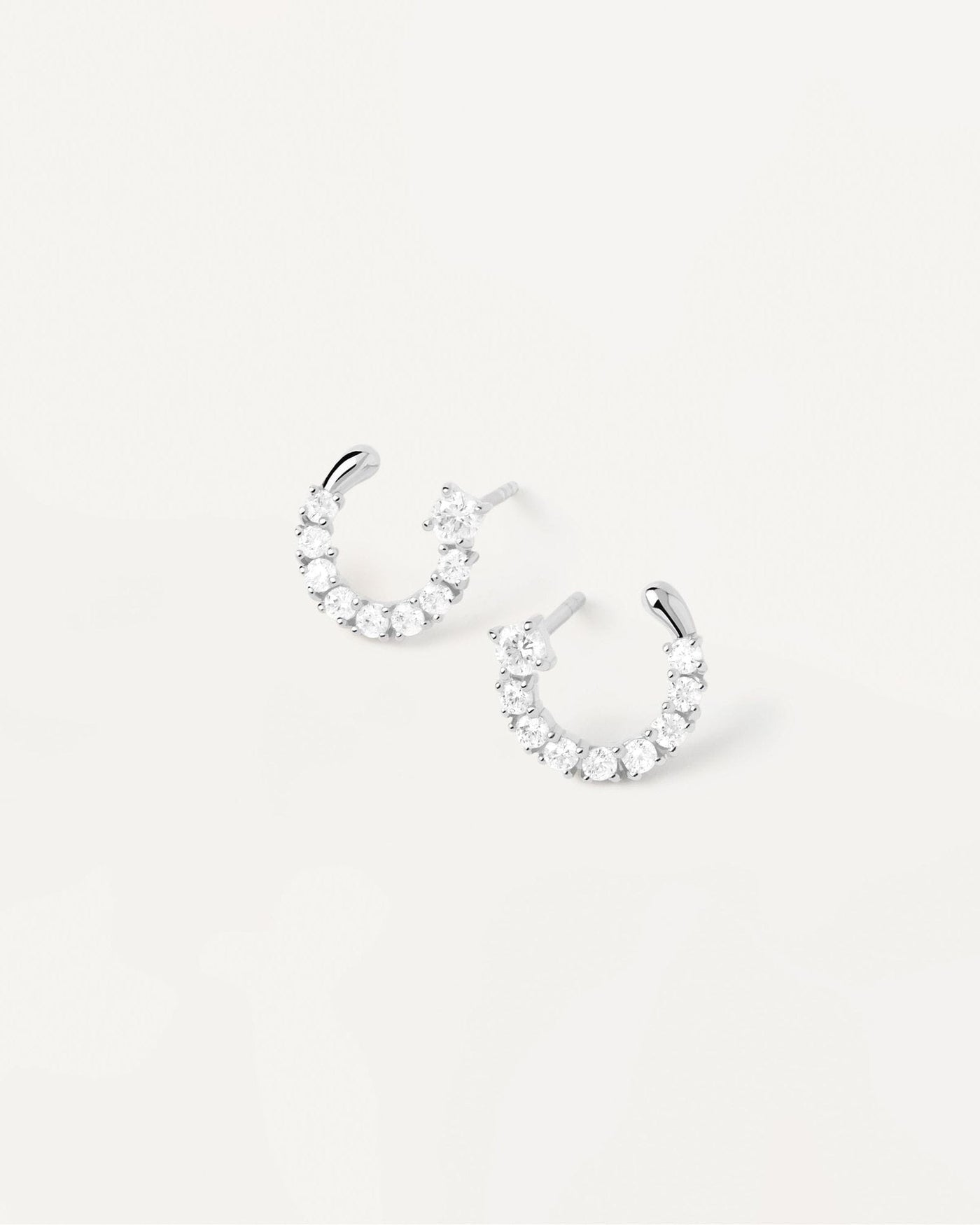 2024 Selection | Leona Silver Earrings. Semi-circle small earrings in sterling silver with white crystals. Get the latest arrival from PDPAOLA. Place your order safely and get this Best Seller. Free Shipping.