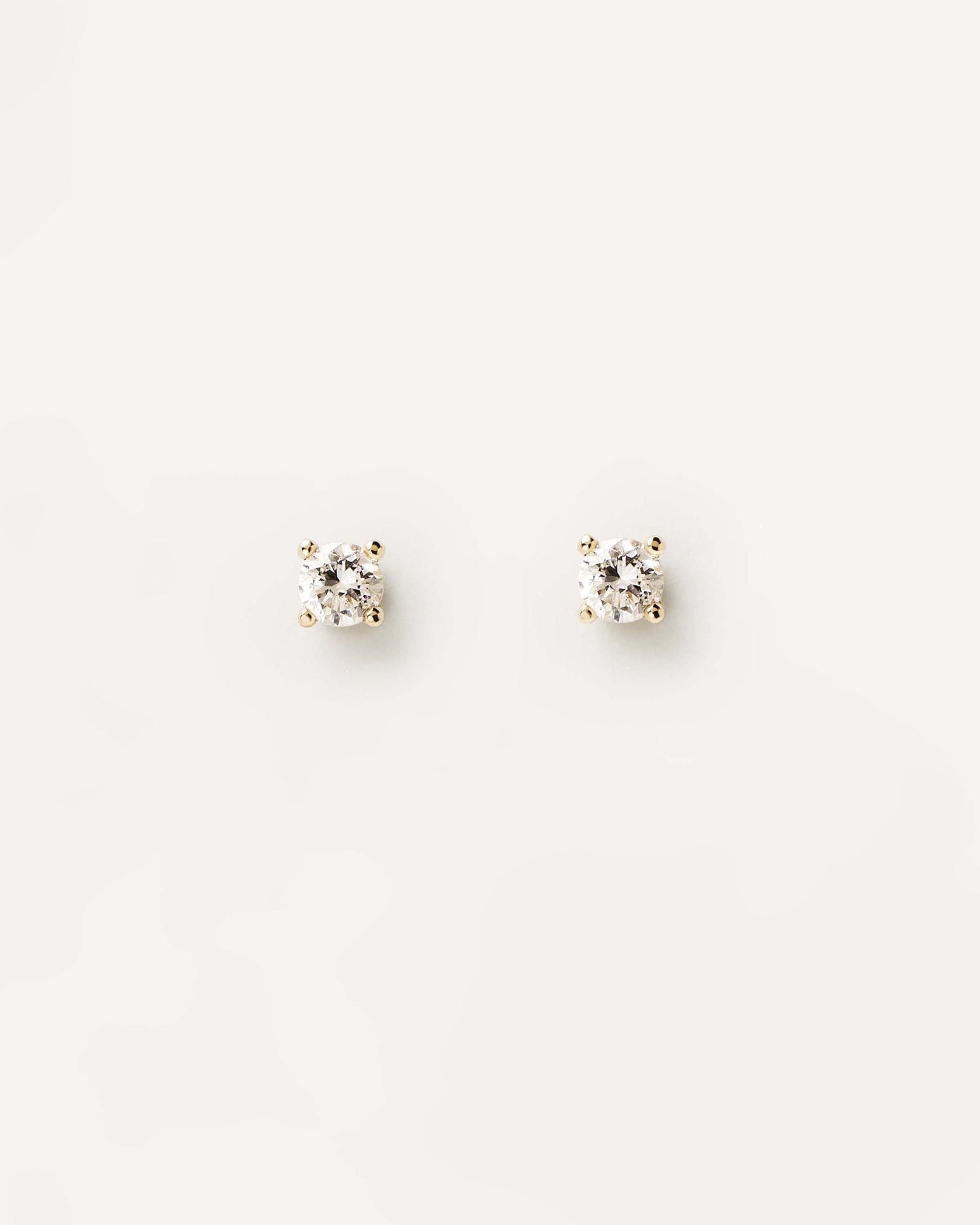 2024 Selection | Diamonds and Gold Solitaire Studs. 18K yellow gold pin earrings with lab-grown solitary diamond of 0.10 carat each. Get the latest arrival from PDPAOLA. Place your order safely and get this Best Seller. Free Shipping.