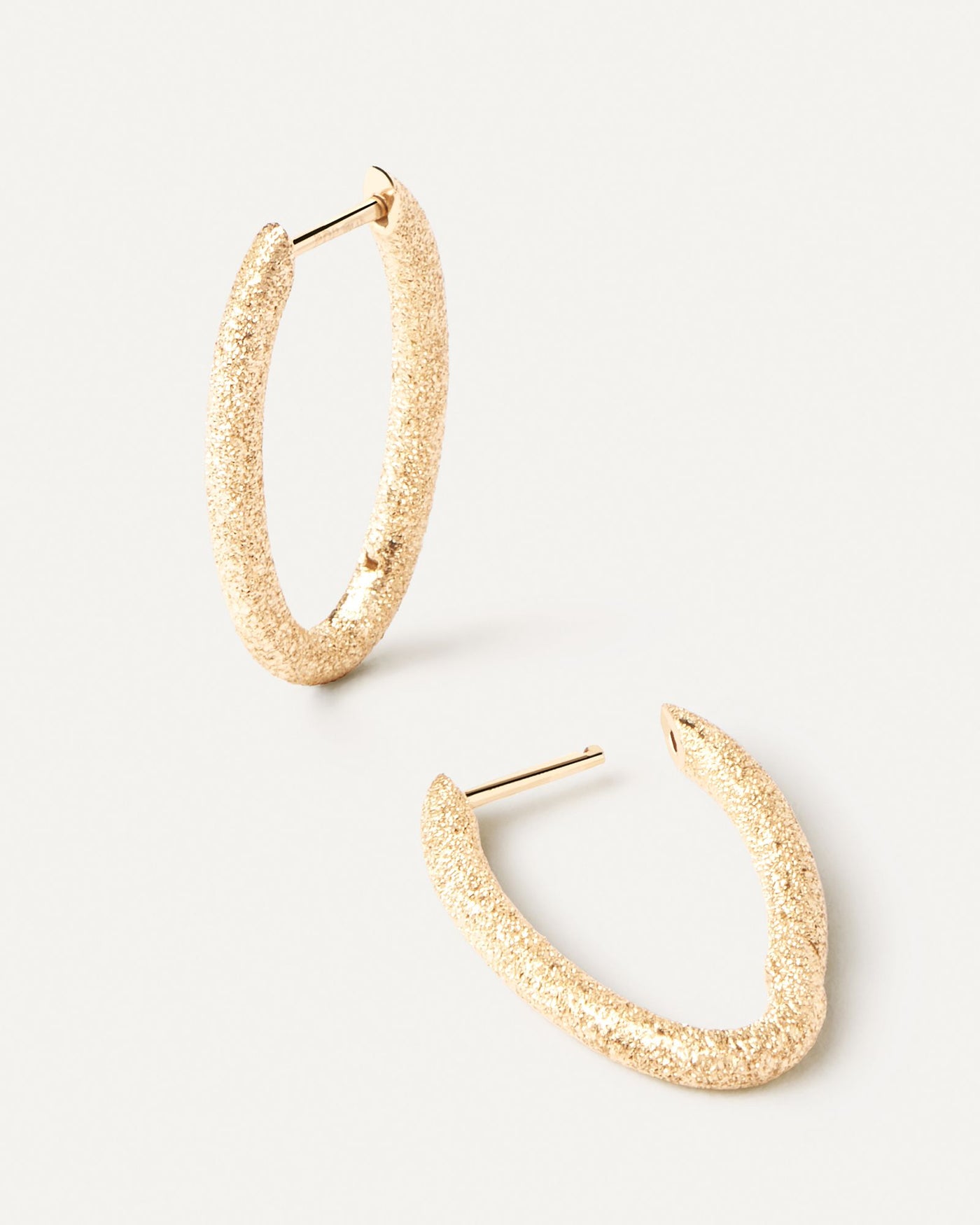 2024 Selection | Sandblasted Gold Vera Hoops. Distinctive oval hoop earrings in solid yellow gold with a sandblast finish. Get the latest arrival from PDPAOLA. Place your order safely and get this Best Seller. Free Shipping.