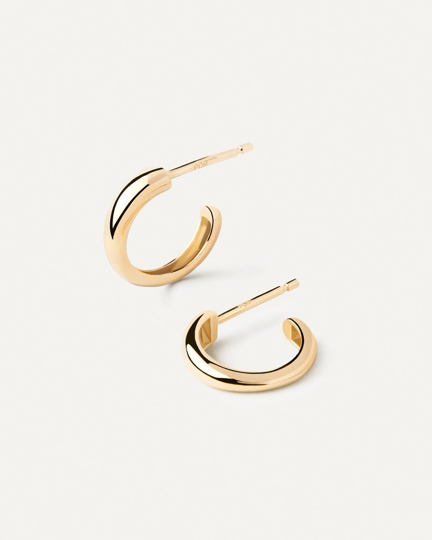 2024 Selection | Gold Joan Mini Hoops. Small hoop earrings in solid 18K yellow gold with rounded edges. Get the latest arrival from PDPAOLA. Place your order safely and get this Best Seller. Free Shipping.