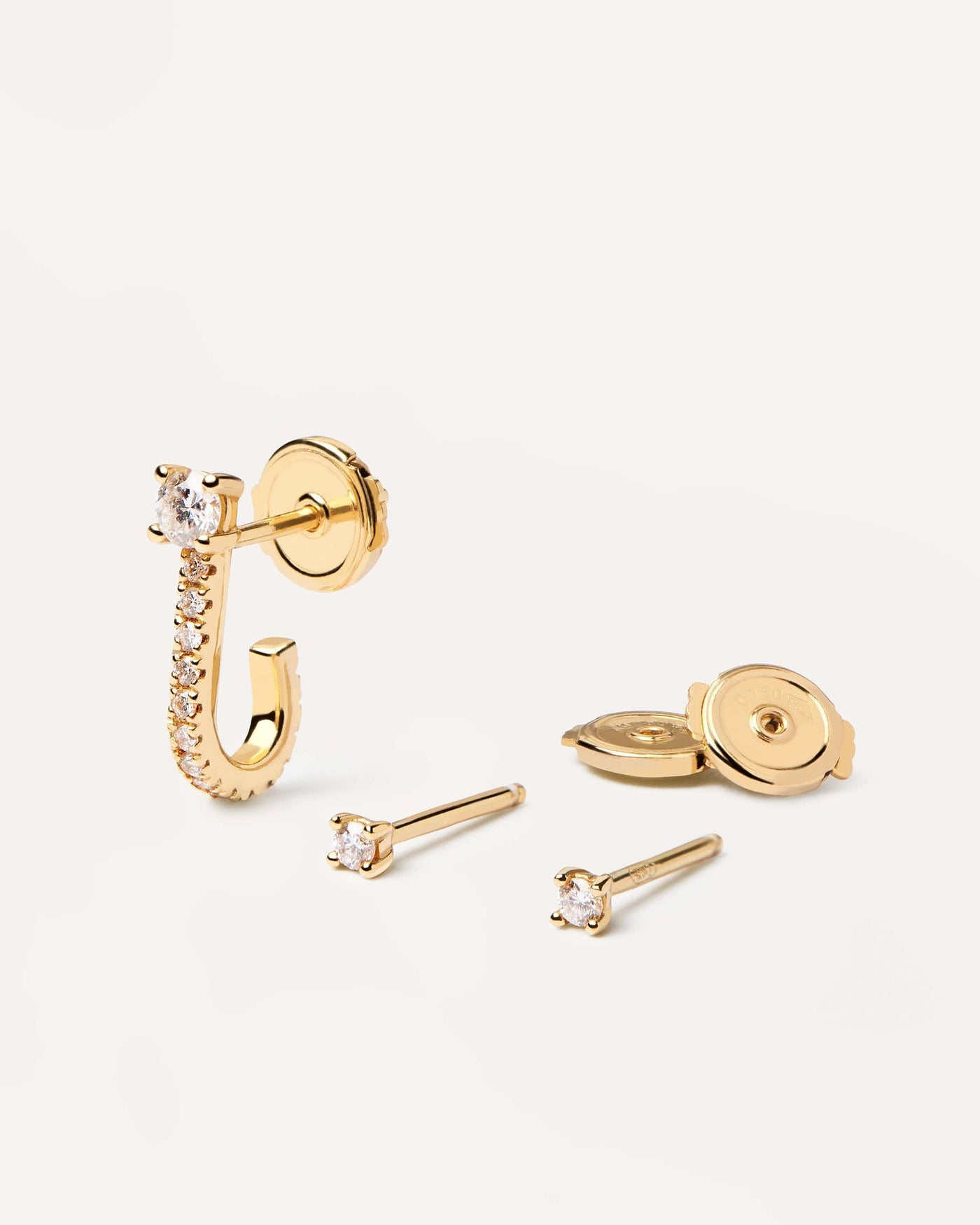 2024 Selection | Diamonds and Gold Eternity Earrings Set. 18K yellow gold earring set made of 2 diamond studs and a diamond wrapper, making 0.29 carats. Get the latest arrival from PDPAOLA. Place your order safely and get this Best Seller. Free Shipping.