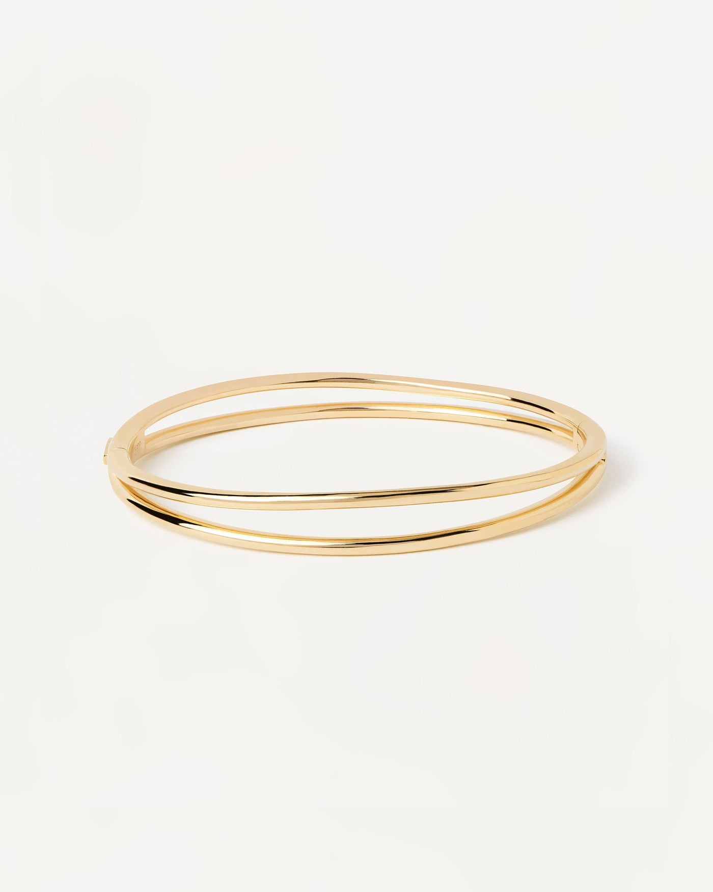 2024 Selection | Twister Bangle. Hinged rigid bracelet with two bands in gold-plated silver. Get the latest arrival from PDPAOLA. Place your order safely and get this Best Seller. Free Shipping.