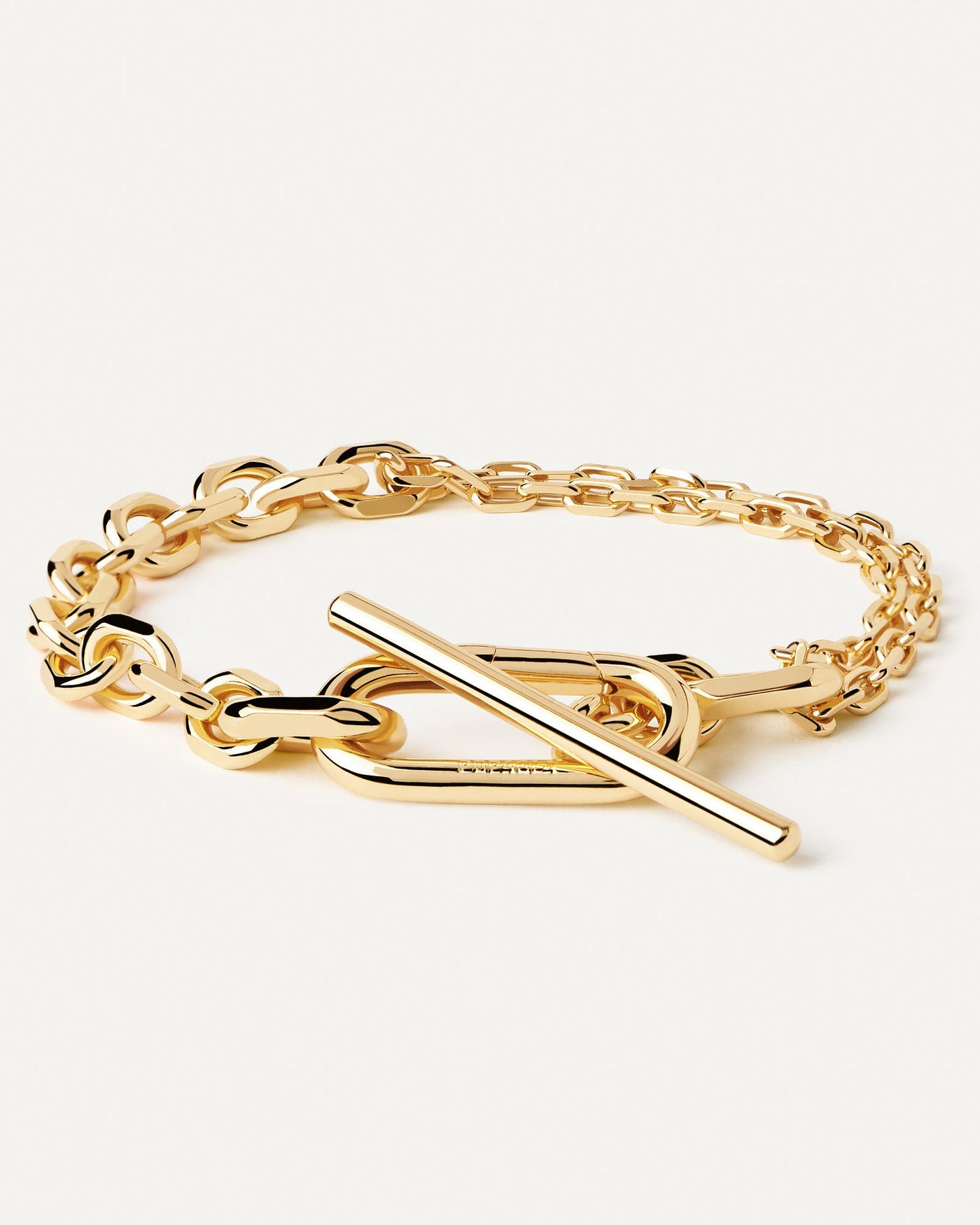 2024 Selection | Vesta Chain Bracelet. Gold-plated double chain T-bar bracelet with bold clasp and asymmetrical links. Get the latest arrival from PDPAOLA. Place your order safely and get this Best Seller. Free Shipping.