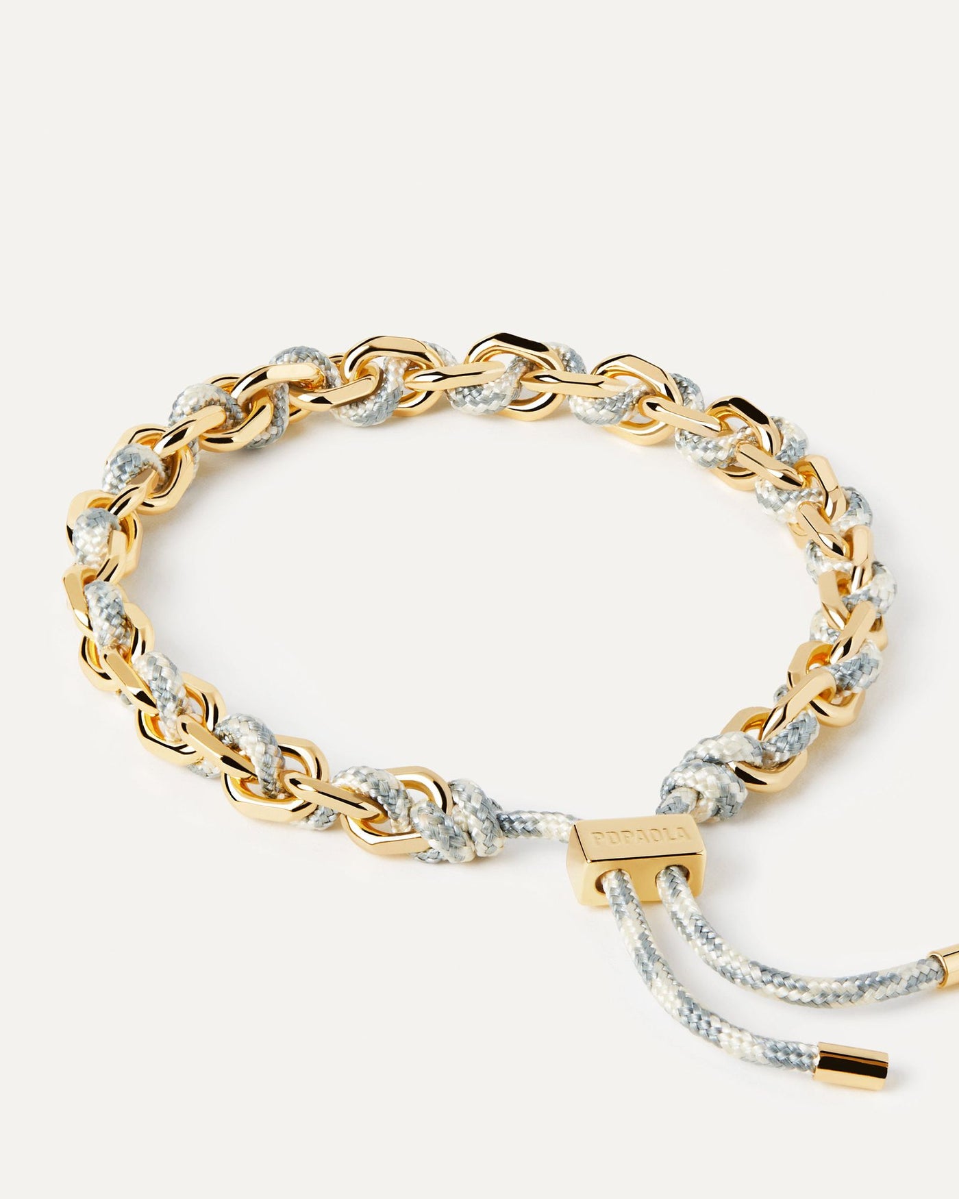 2024 Selection | Sky Rope and Chain Bracelet. Golden chain bracelet with a blue and white rope adjustable sliding clasp. Get the latest arrival from PDPAOLA. Place your order safely and get this Best Seller. Free Shipping.