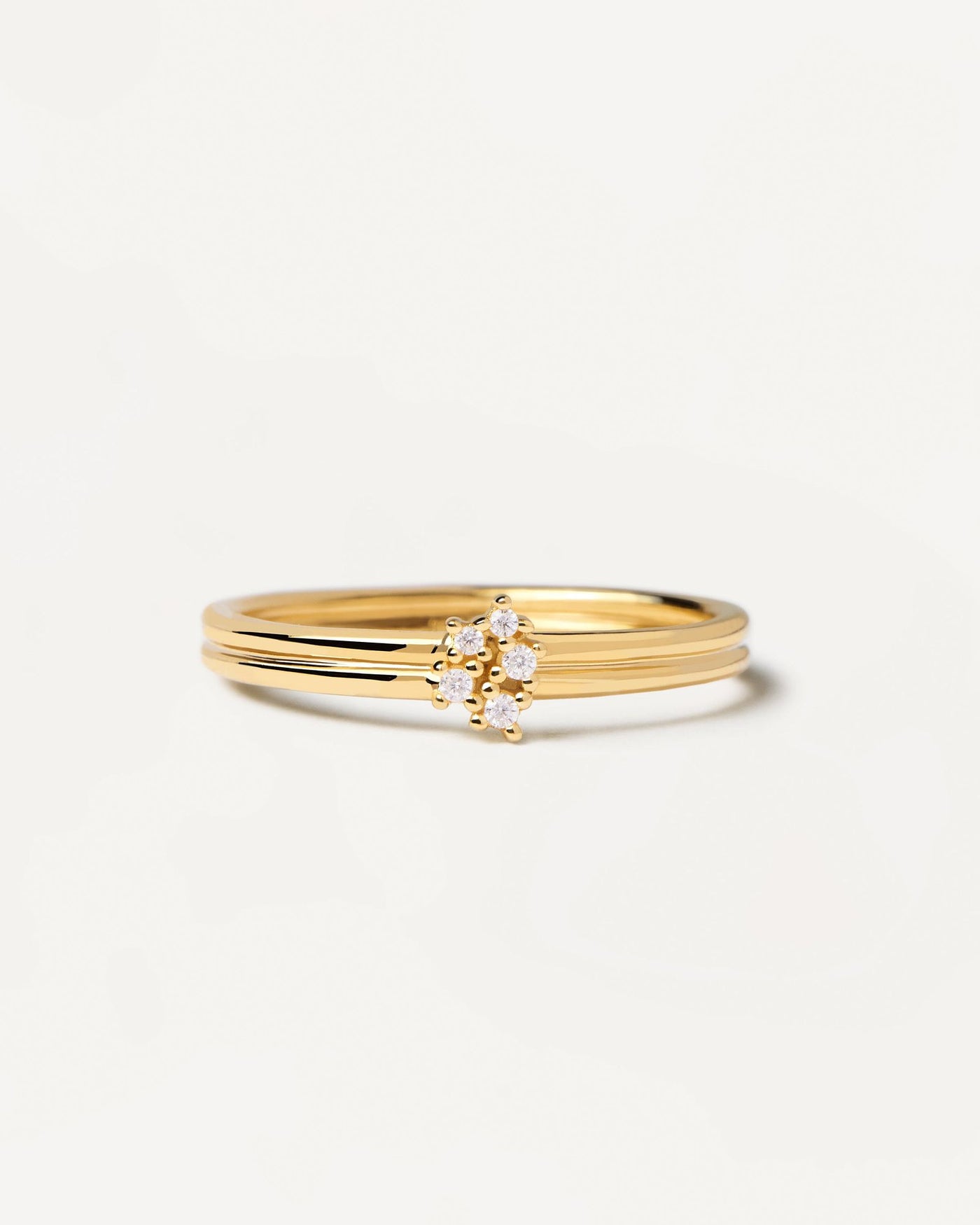 2024 Selection | Nova Ring. Gold-plated silver ring with two bands set with five dainty zirconias. Get the latest arrival from PDPAOLA. Place your order safely and get this Best Seller. Free Shipping.