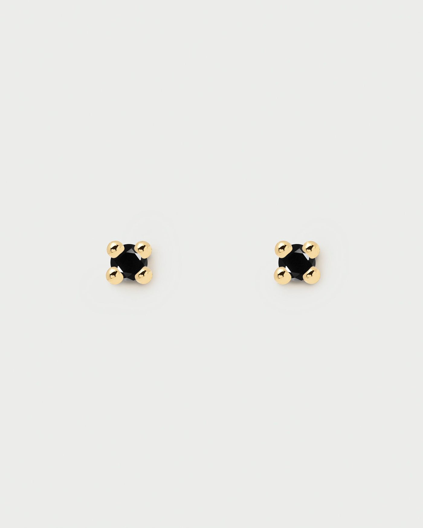 2024 Selection | Black Essentia Earrings. 18k gold plated silver stud earrings with a cut black zirconia . Get the latest arrival from PDPAOLA. Place your order safely and get this Best Seller. Free Shipping.