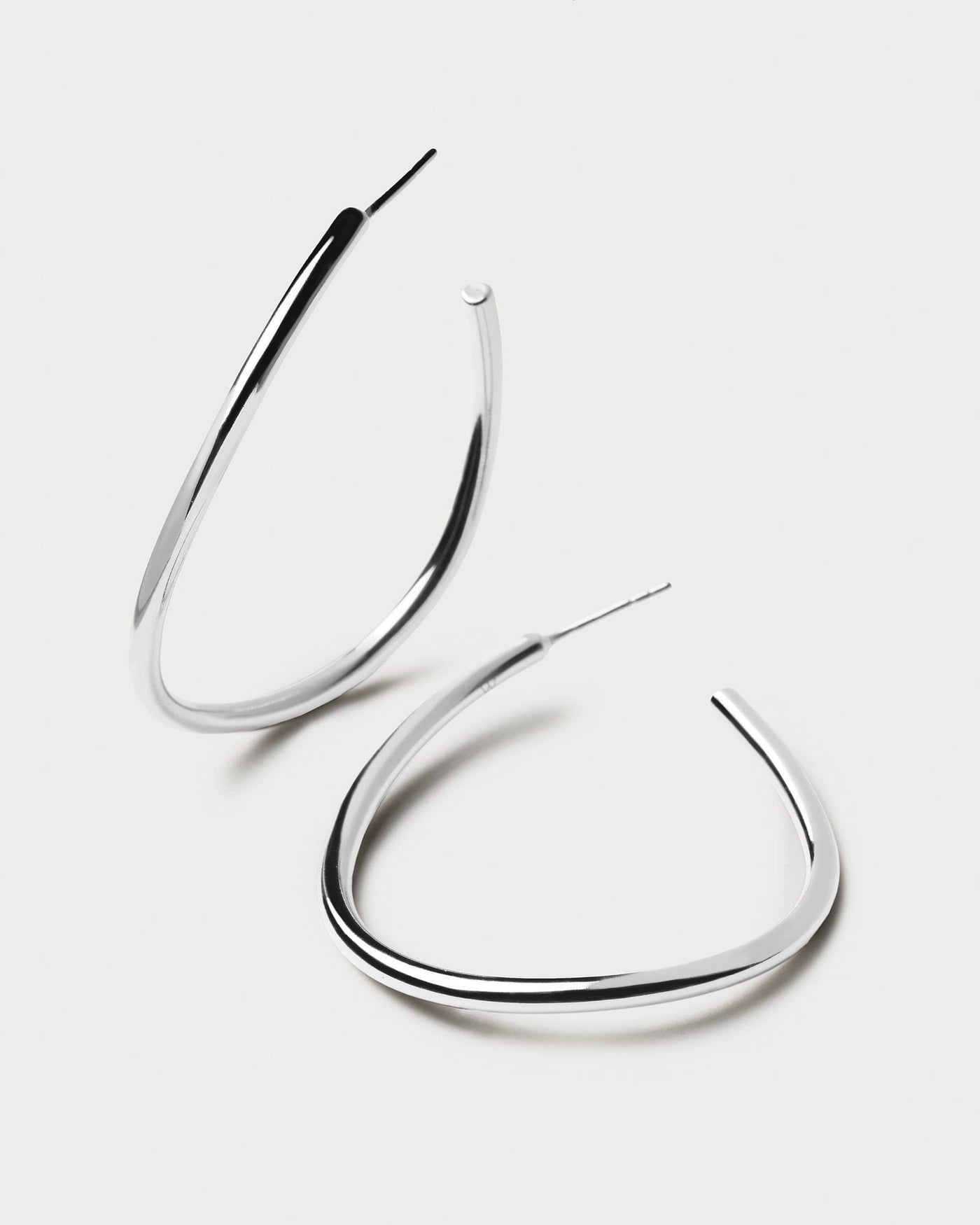 2024 Selection | Yoko Silver Earrings. Open loop large wavy hoop earrings in 925 sterling silver . Get the latest arrival from PDPAOLA. Place your order safely and get this Best Seller. Free Shipping.