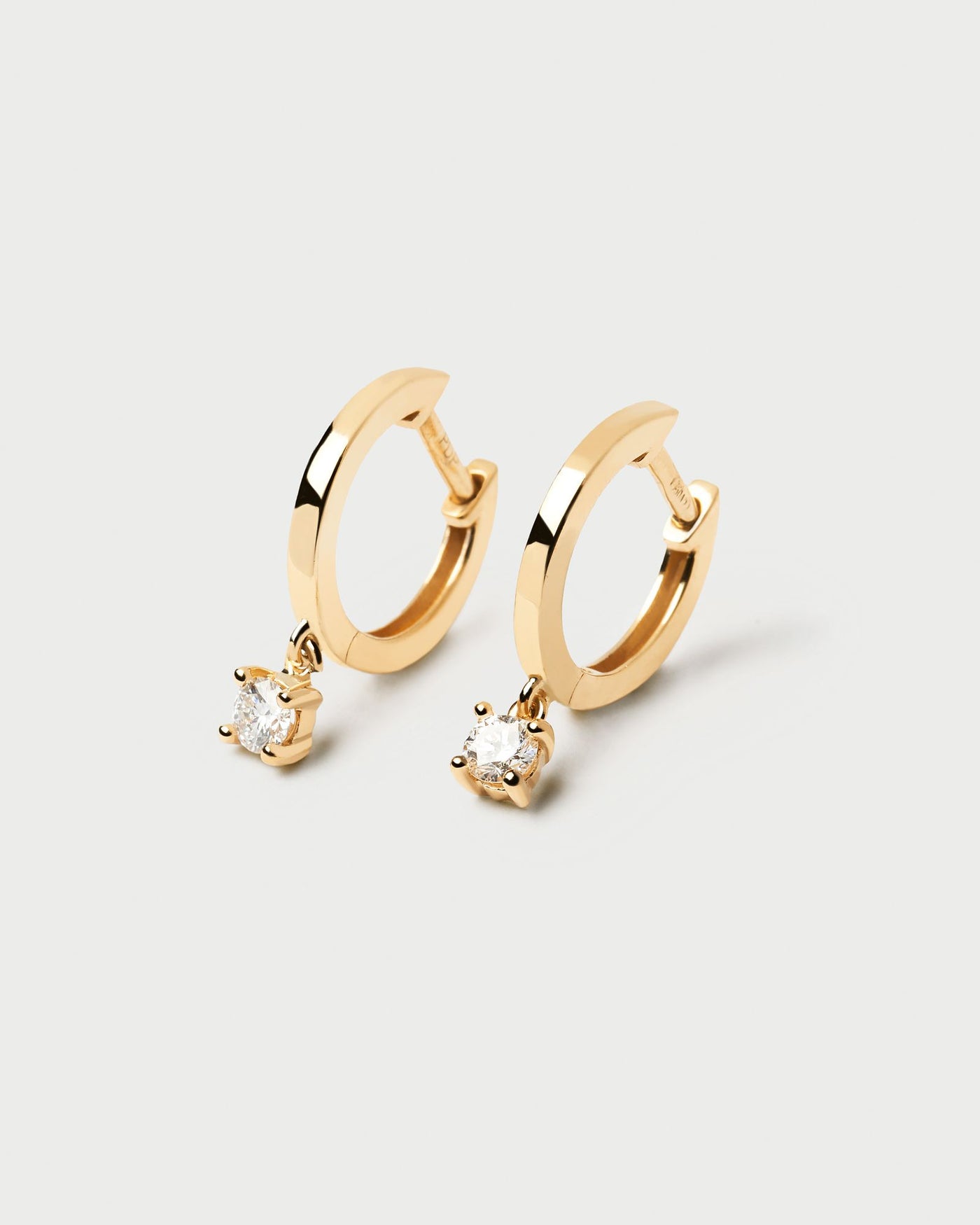 2024 Selection | Diamonds and Gold Drop Hoops. Hoop earrings in solid yellow gold with hanging lab-grown diamond of 0.10 carats each. Get the latest arrival from PDPAOLA. Place your order safely and get this Best Seller. Free Shipping.