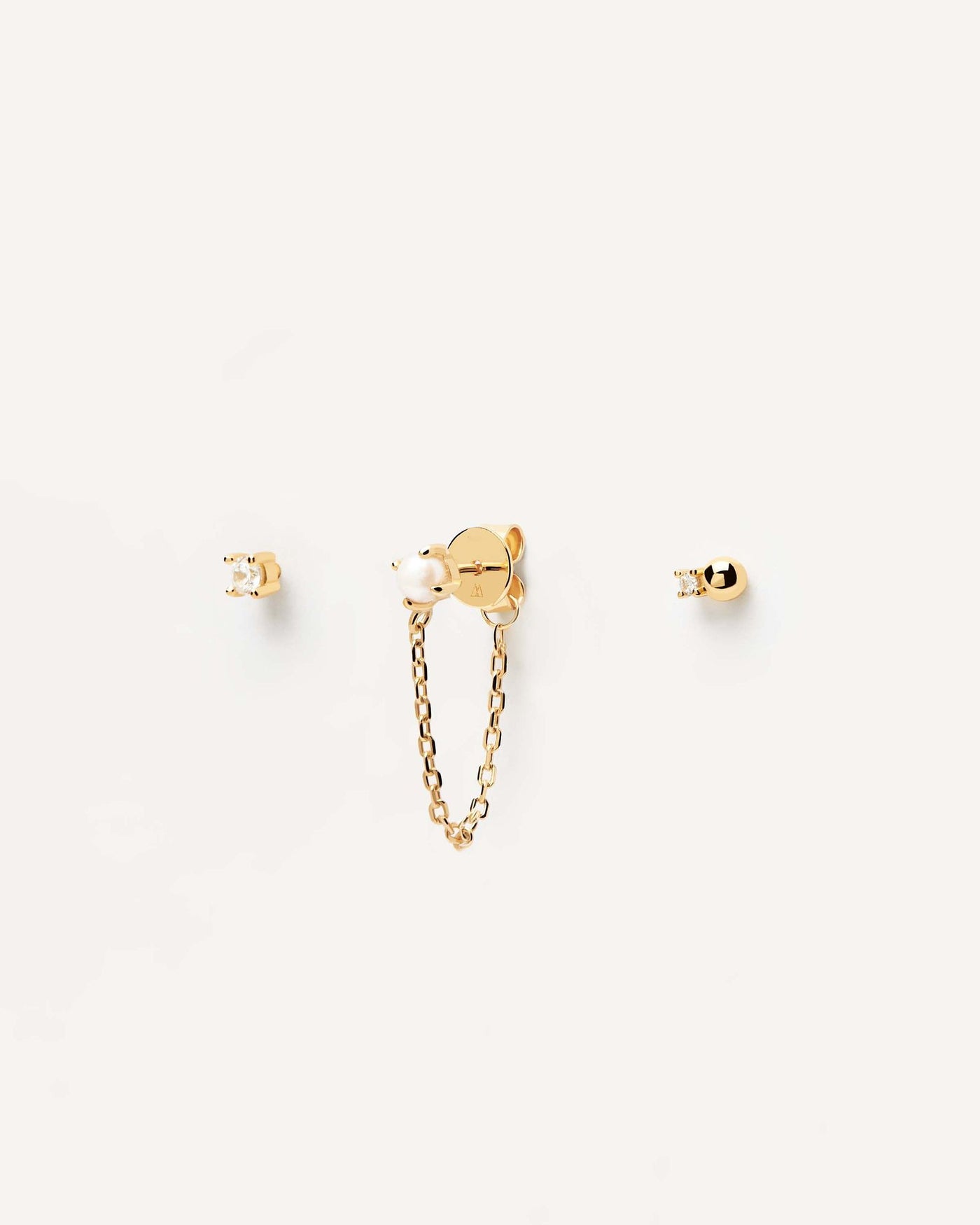 2024 Selection | Charlie Earrings Set. Set of three single earrings in 18k gold plated silver; a pearl stud with a chain and two zirconia. Get the latest arrival from PDPAOLA. Place your order safely and get this Best Seller. Free Shipping.