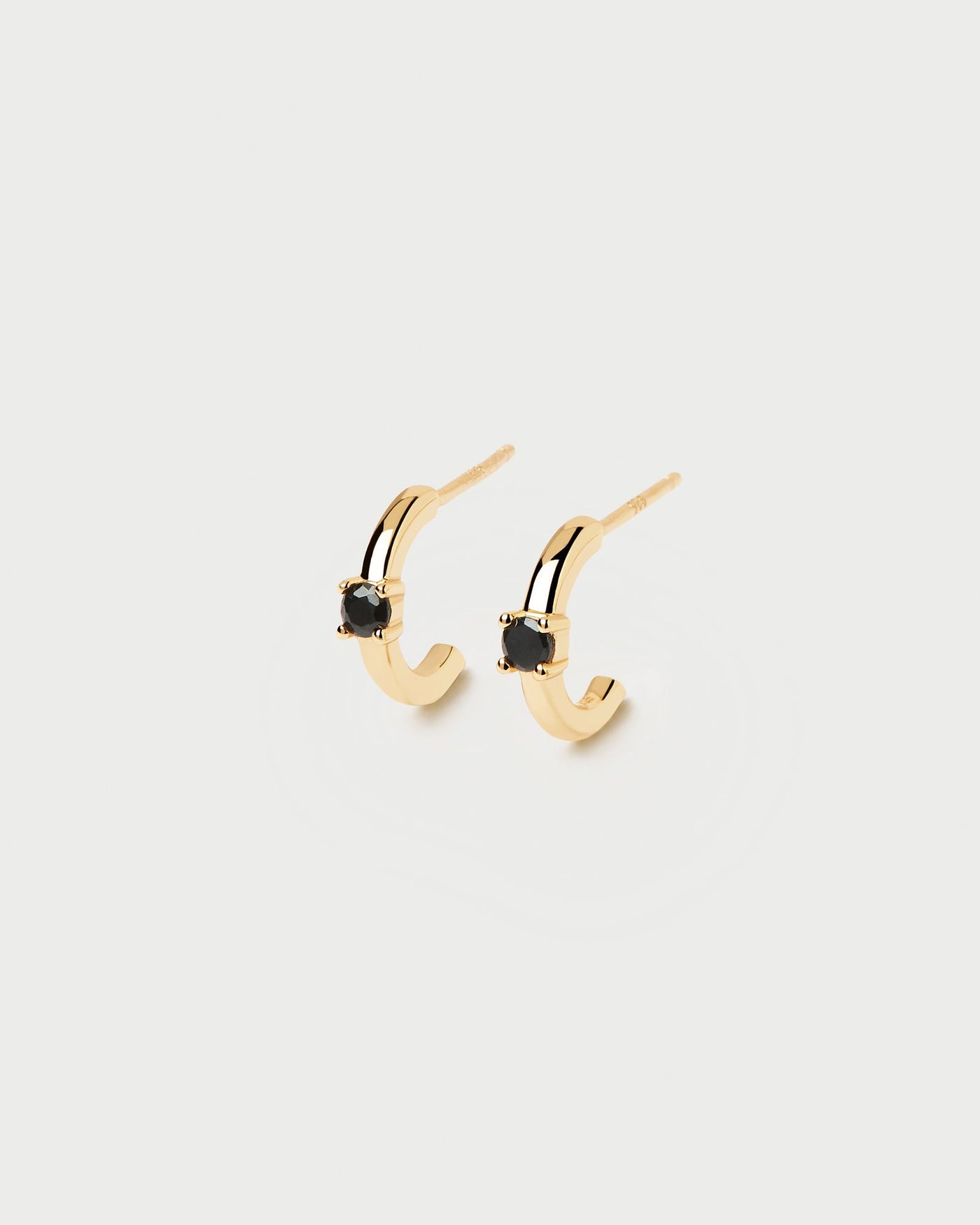 2024 Selection | Black Solitary Earrings. 18k gold plated silver c hoops with a round-cut black zirconia stone. Get the latest arrival from PDPAOLA. Place your order safely and get this Best Seller. Free Shipping.