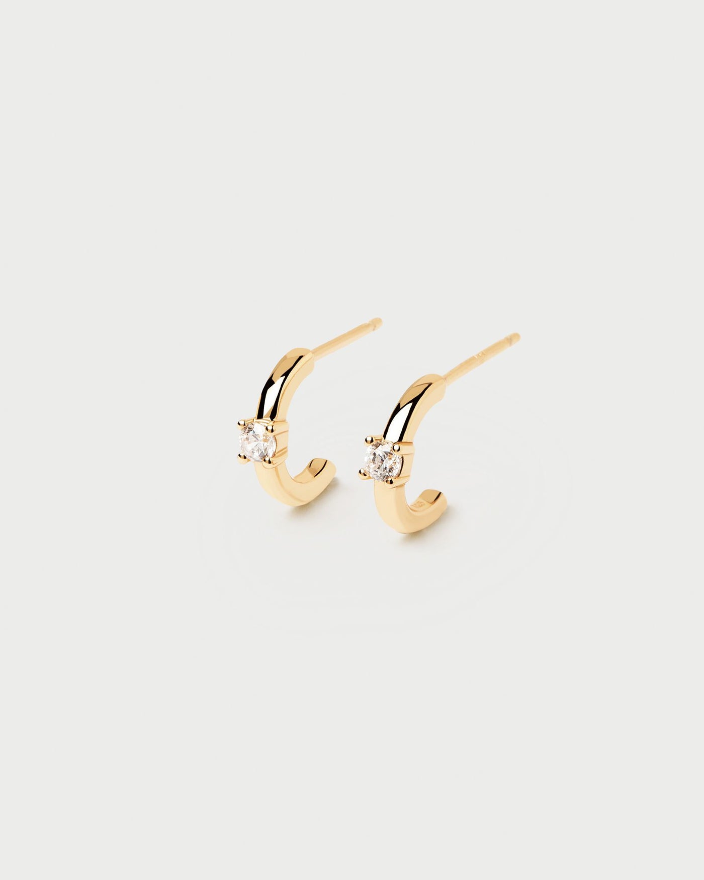 2024 Selection | White Solitary Earrings. 18k gold plated silver c hoops with a round-cut white zirconia stone set on prongs. Get the latest arrival from PDPAOLA. Place your order safely and get this Best Seller. Free Shipping.