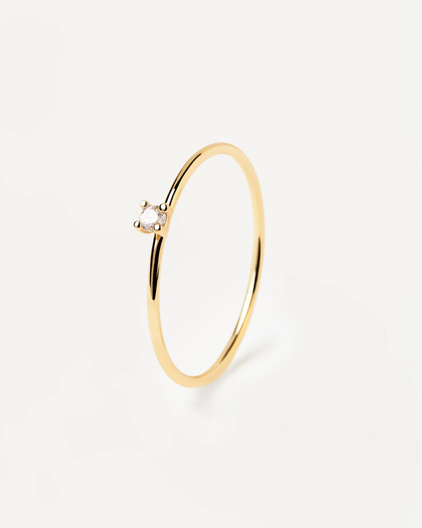 2024 Selection | White Solitary Ring. 18k gold plated silver ring with a single round cut white zirconia. Get the latest arrival from PDPAOLA. Place your order safely and get this Best Seller. Free Shipping.