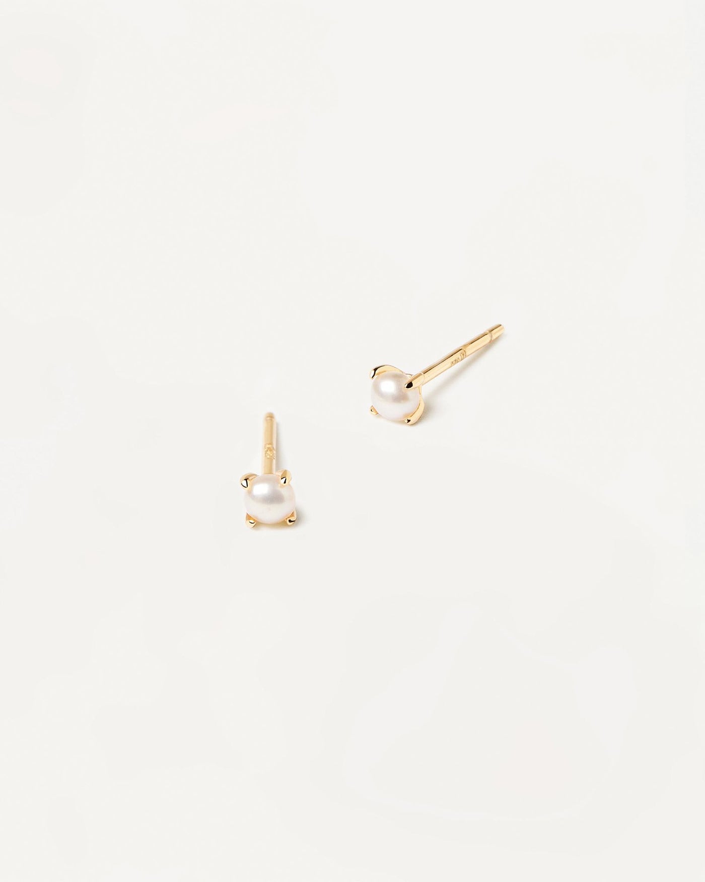 2024 Selection | Solitary Mini Pearl Earrings. Pair of 18k gold plated single small natural pearl studs set on prongs. Get the latest arrival from PDPAOLA. Place your order safely and get this Best Seller. Free Shipping.