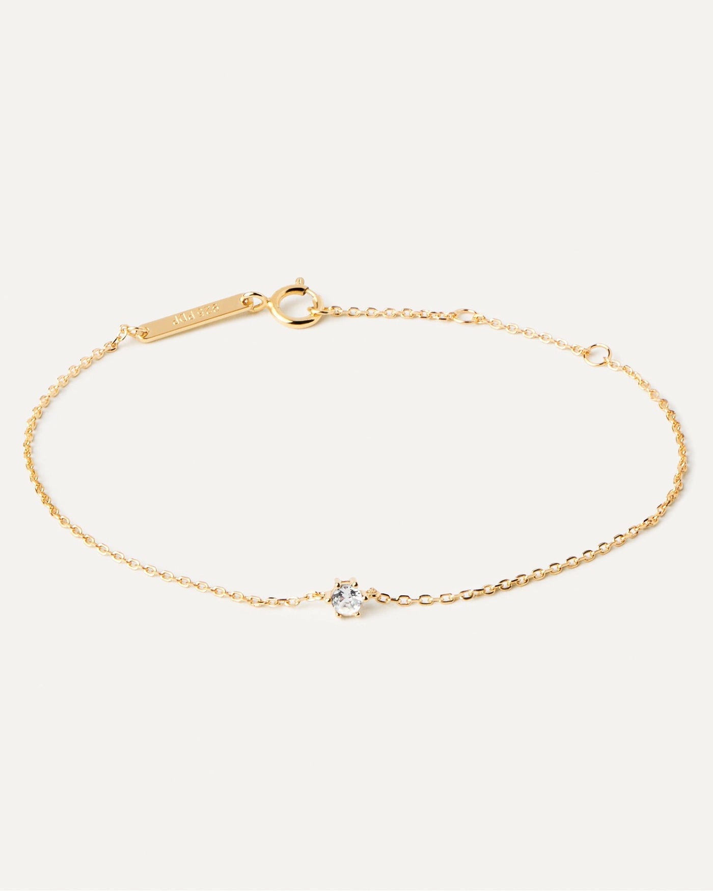 2024 Selection | White Solitary Bracelet. Thin chain bracelet in 18k gold plated silver and a white zirconia. Get the latest arrival from PDPAOLA. Place your order safely and get this Best Seller. Free Shipping.